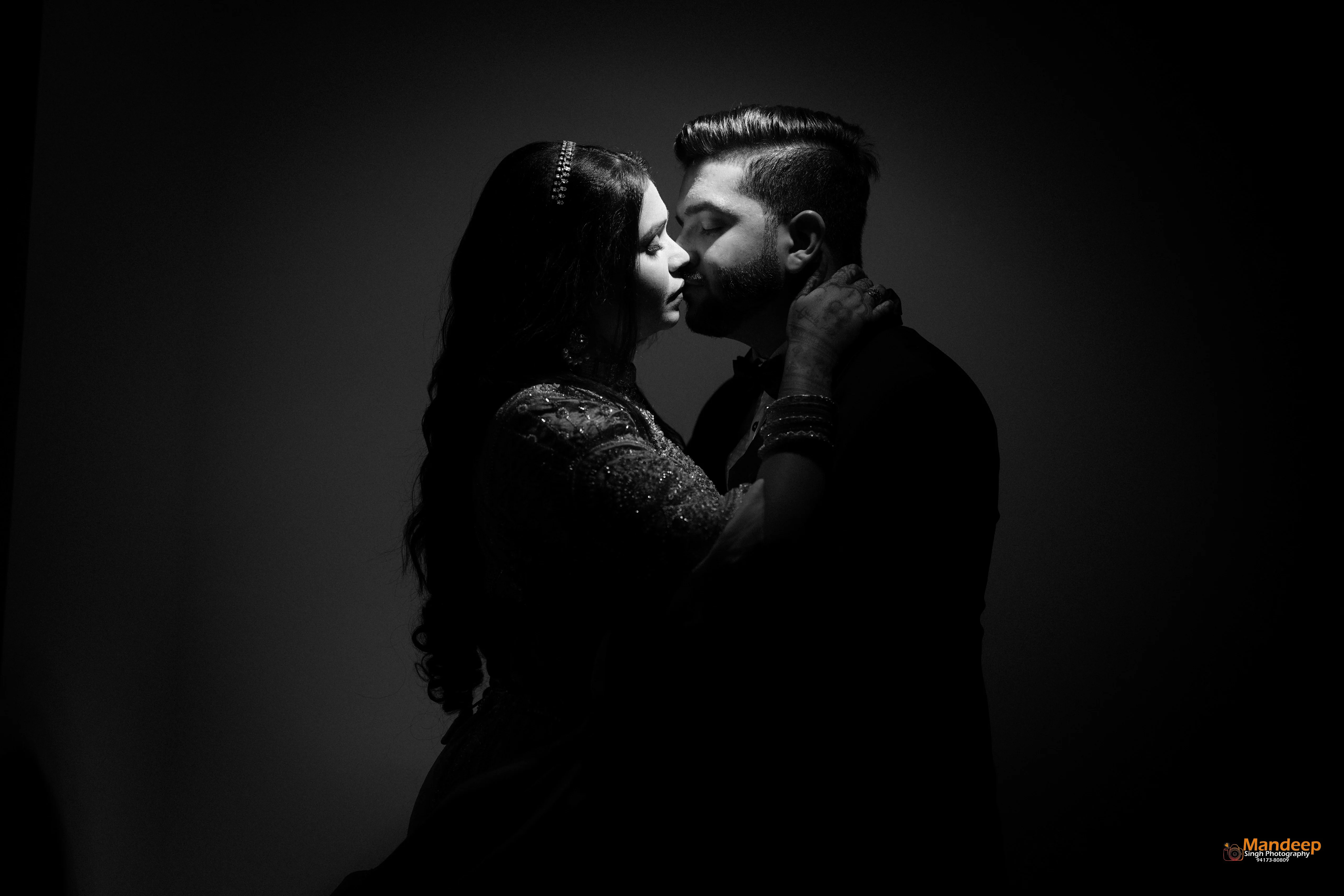 Tanya and Vyom in a dramatic black and white portrait